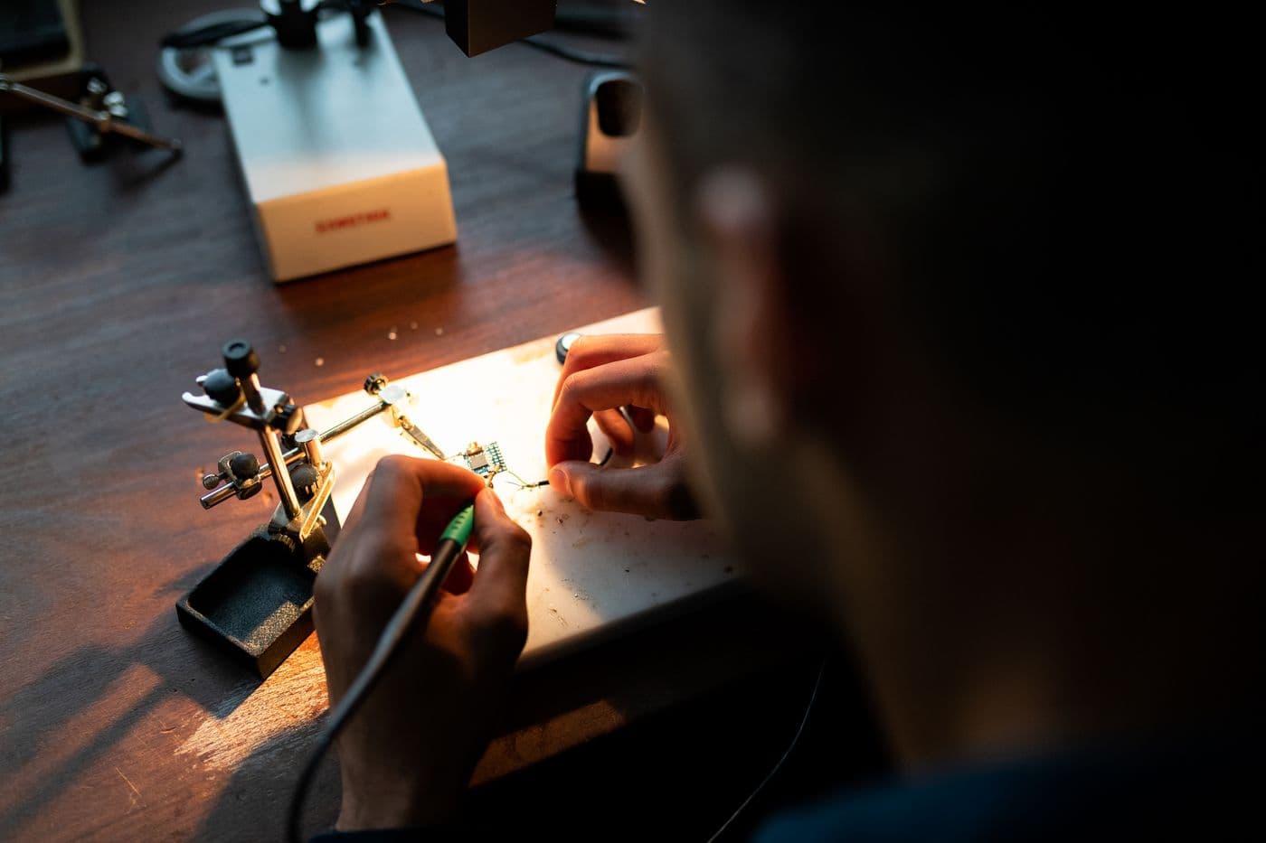 Engineer inspecting equipment in a workshop