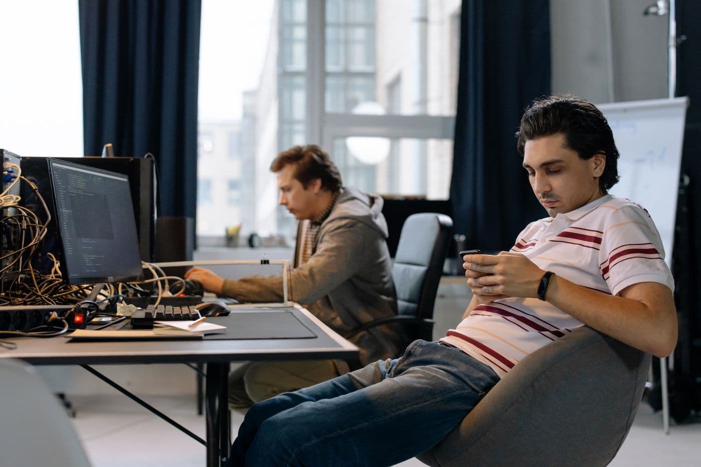 Team celebrating a successful launch at a workstation